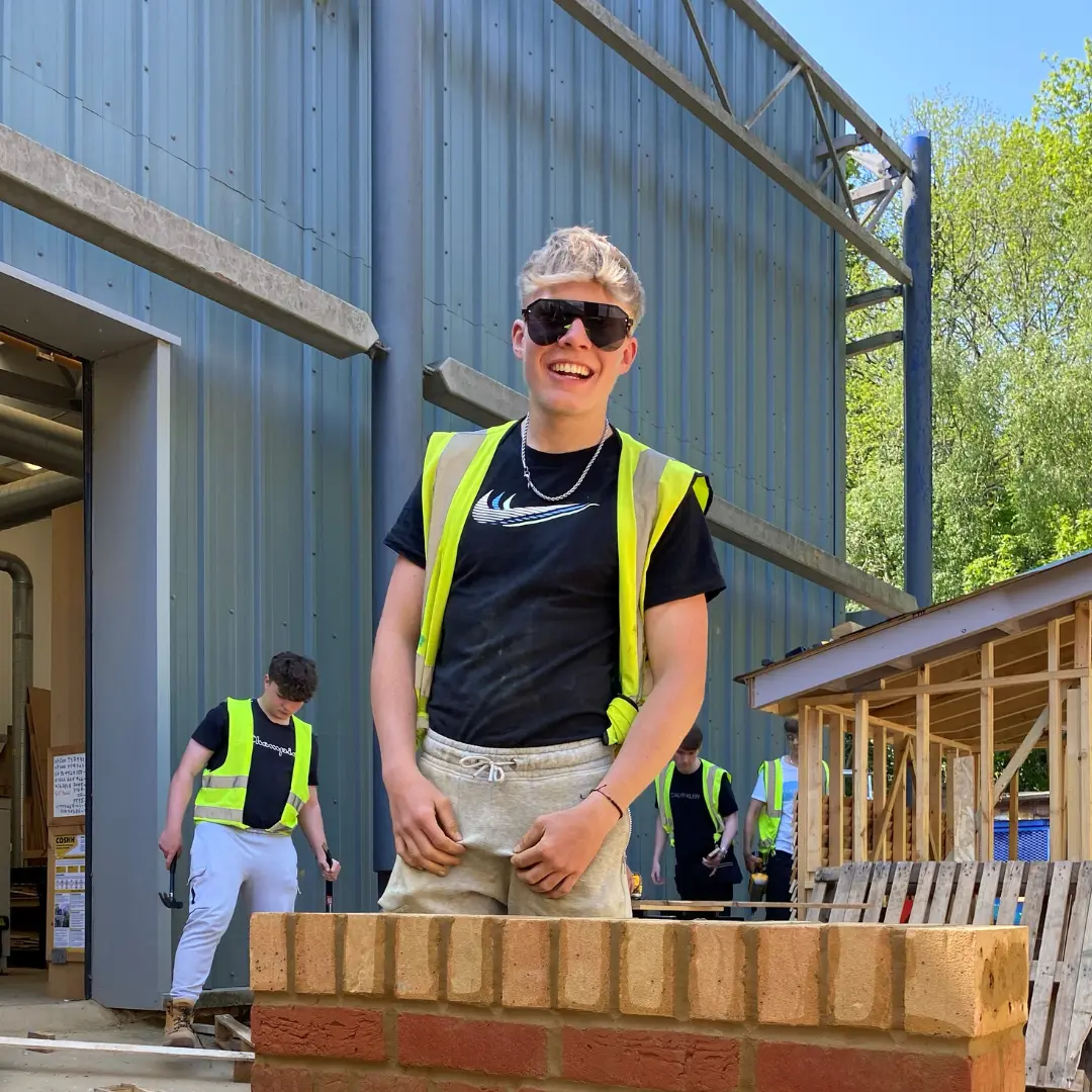 Archie with the brick wall he built for the comeptition